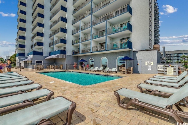 view of pool featuring a patio area