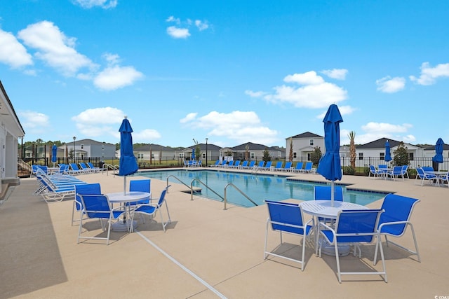 view of swimming pool featuring a patio area