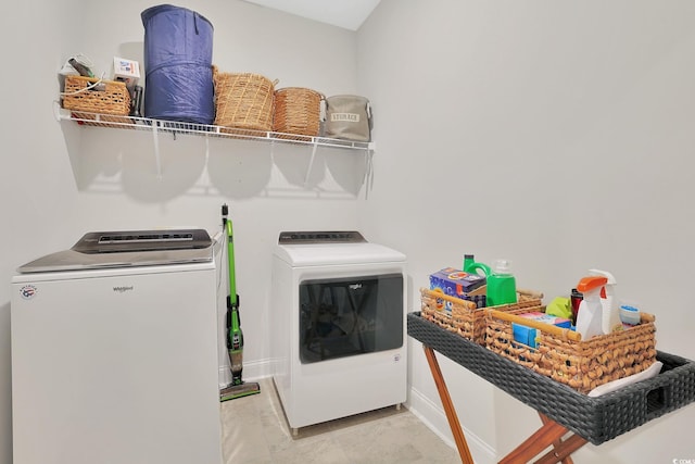 clothes washing area with separate washer and dryer