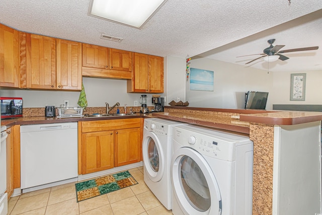 kitchen featuring dishwasher, a textured ceiling, light tile patterned flooring, sink, and ceiling fan