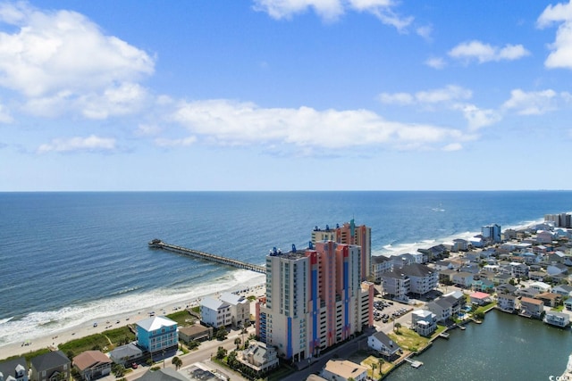 drone / aerial view featuring a view of the beach and a water view