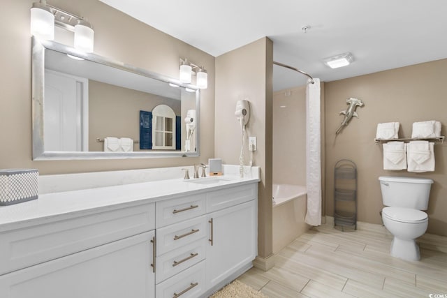 full bathroom featuring shower / bath combo, hardwood / wood-style flooring, vanity, and toilet