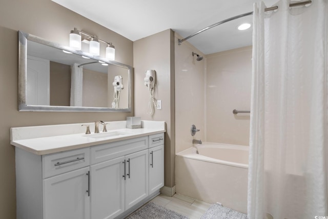 bathroom with shower / bath combination with curtain and vanity