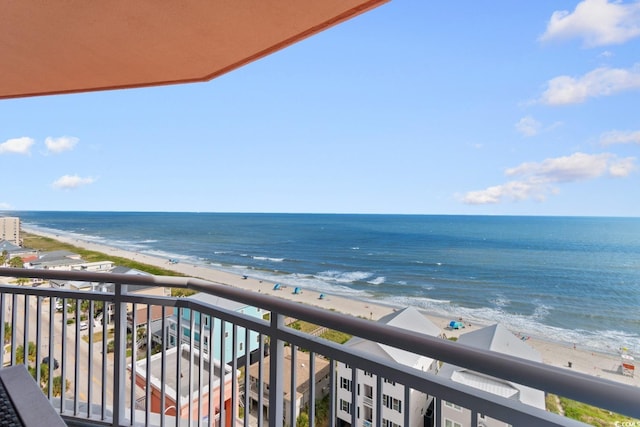 balcony with a beach view and a water view