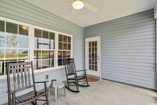 view of patio featuring ceiling fan