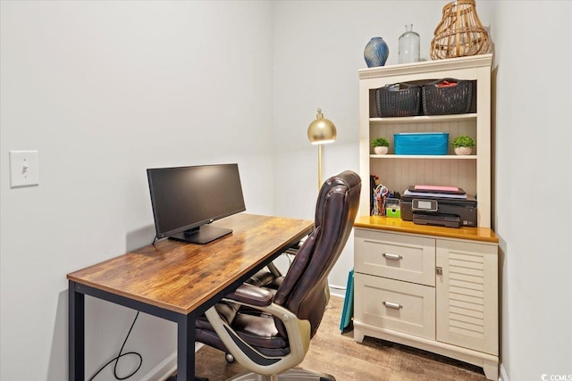 office space with light hardwood / wood-style floors