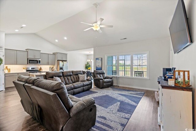 living room featuring high vaulted ceiling, ceiling fan, and hardwood / wood-style flooring