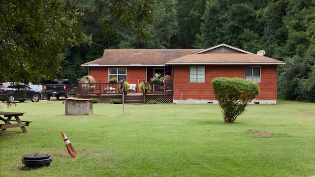 exterior space featuring a lawn and a wooden deck