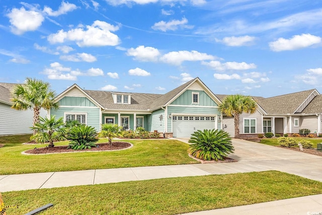 view of front of house featuring a garage and a front yard