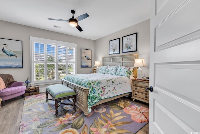 bedroom featuring ceiling fan and hardwood / wood-style flooring