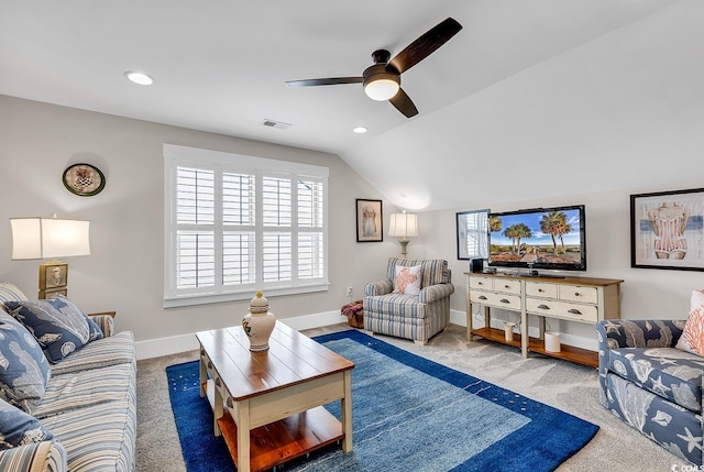 carpeted living room with vaulted ceiling and ceiling fan