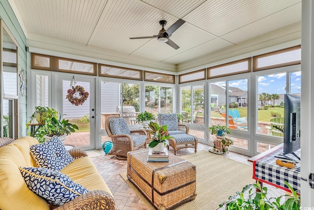 sunroom / solarium with ceiling fan and wooden ceiling