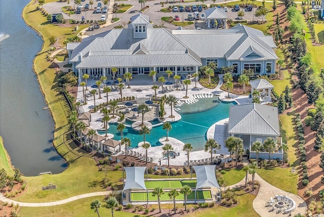 birds eye view of property with a water view