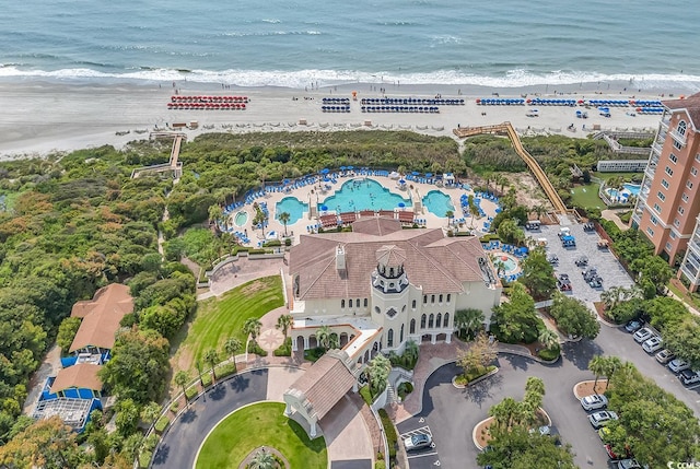 bird's eye view featuring a view of the beach and a water view