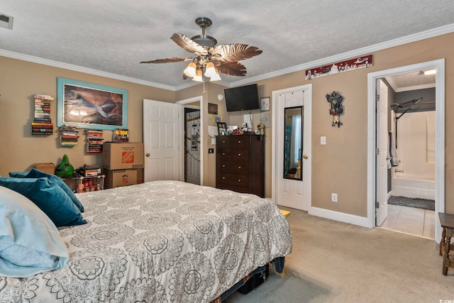 bedroom with connected bathroom, a textured ceiling, crown molding, ceiling fan, and light carpet