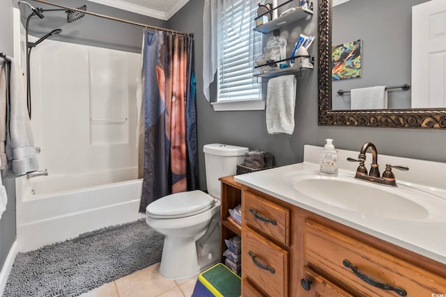 full bathroom with tile patterned flooring, ornamental molding, shower / tub combo with curtain, vanity, and toilet