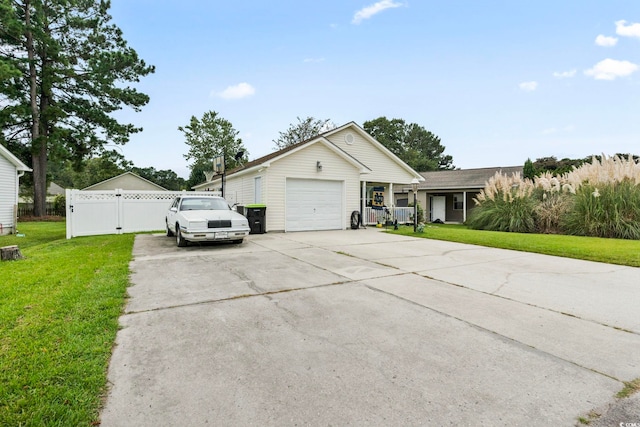 view of front facade with a garage and a front lawn