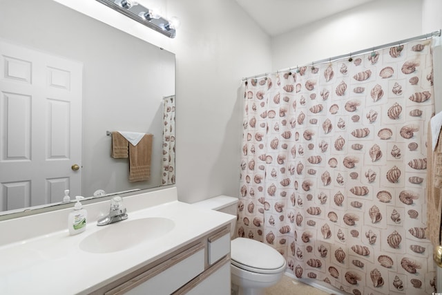 bathroom featuring vanity, toilet, and a shower with curtain