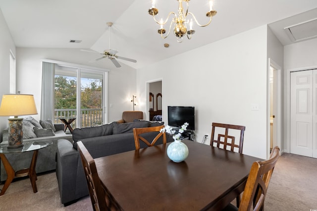 dining space featuring ceiling fan with notable chandelier, lofted ceiling, and carpet