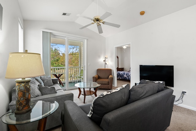 carpeted living room with lofted ceiling and ceiling fan