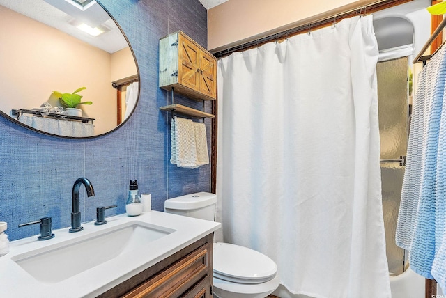 full bathroom with shower / bath combo, vanity, and toilet