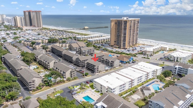 bird's eye view with a view of the beach and a water view