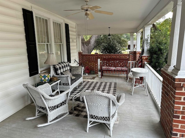 wooden deck featuring ceiling fan and covered porch