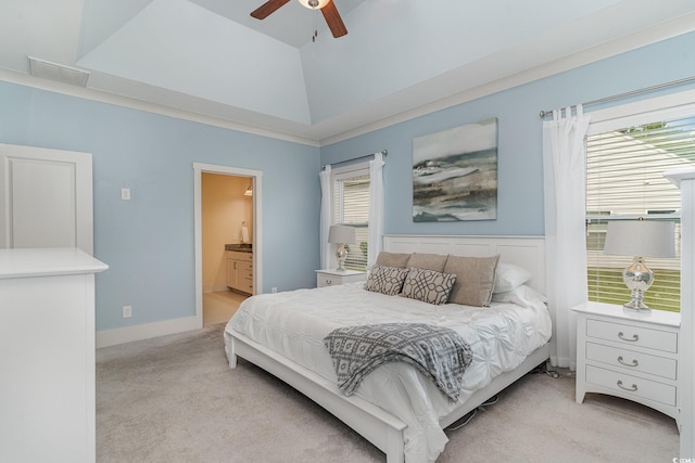 bedroom featuring visible vents, light colored carpet, ceiling fan, and connected bathroom
