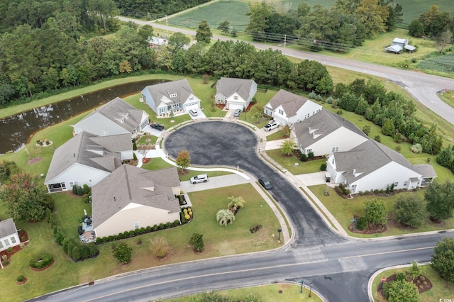 aerial view with a water view and a residential view