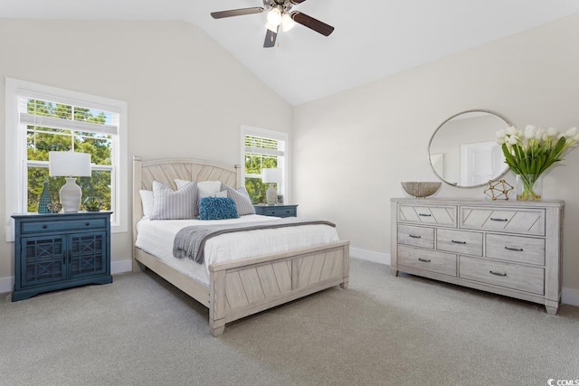 carpeted bedroom with high vaulted ceiling and ceiling fan