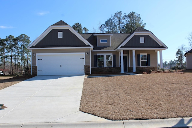 craftsman-style home with a porch and a garage