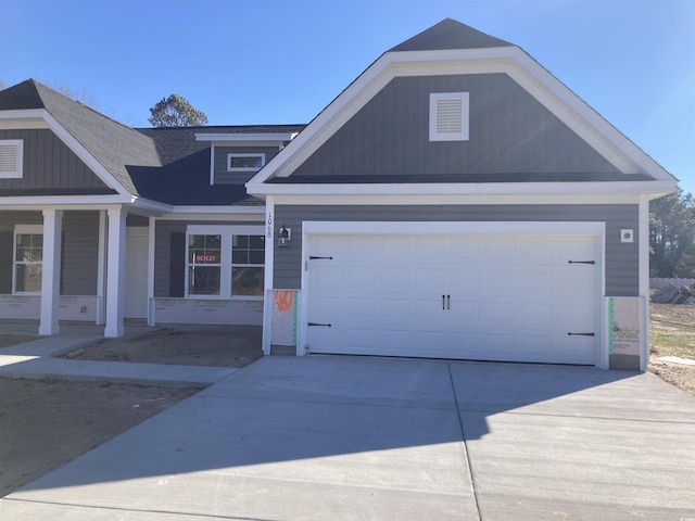 view of front of house with a garage and covered porch