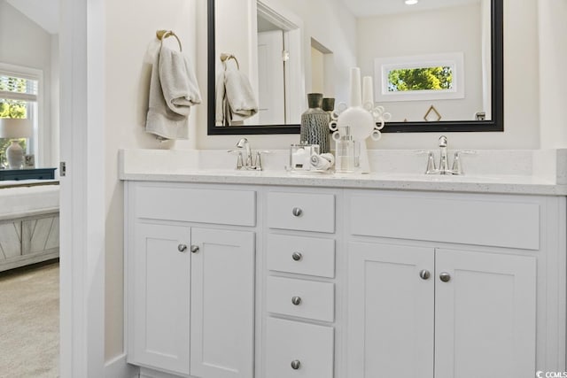 bathroom featuring a healthy amount of sunlight and vanity