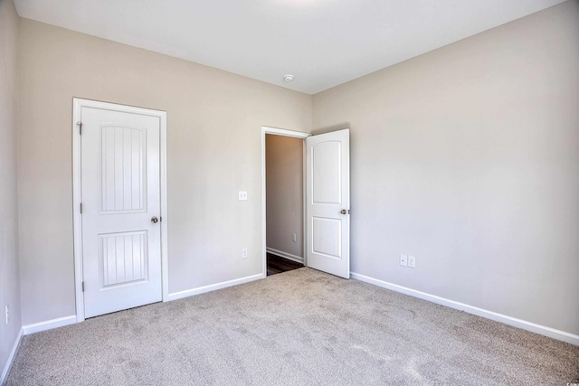 unfurnished bedroom with light carpet