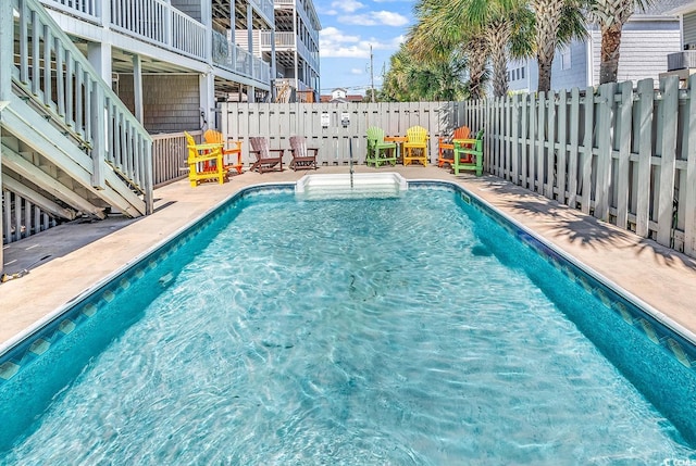 view of swimming pool featuring a patio