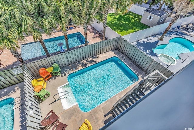 view of swimming pool featuring a patio area