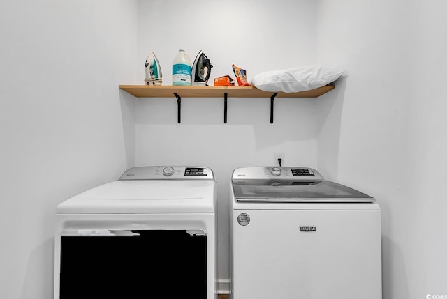 clothes washing area featuring washing machine and dryer