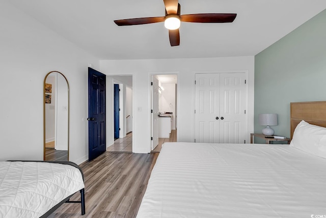 bedroom featuring wood-type flooring and ceiling fan