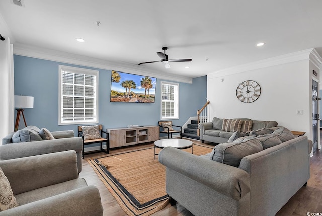 living room with ceiling fan, hardwood / wood-style flooring, and crown molding