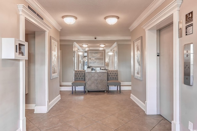 corridor with a textured ceiling, ornamental molding, light tile patterned floors, and elevator