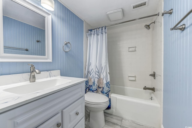 full bathroom with shower / bath combo, vanity, and toilet