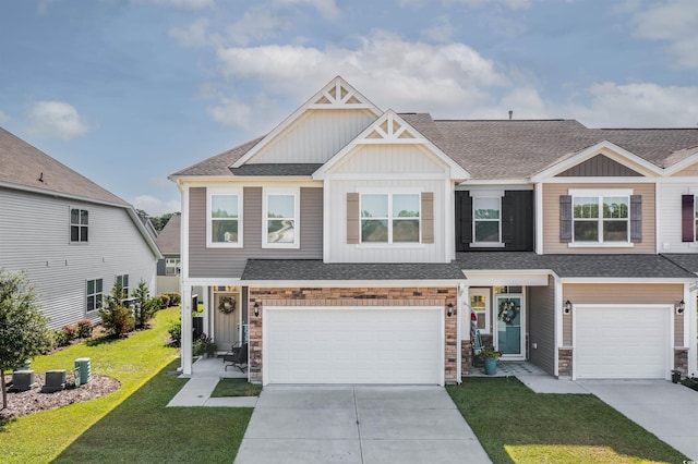 view of front of home with a front lawn and a garage