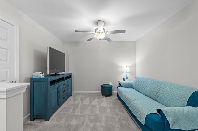 carpeted living room featuring ceiling fan