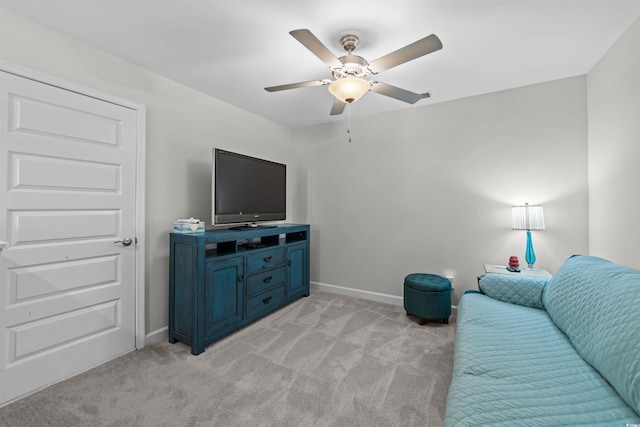 living room featuring ceiling fan and light colored carpet