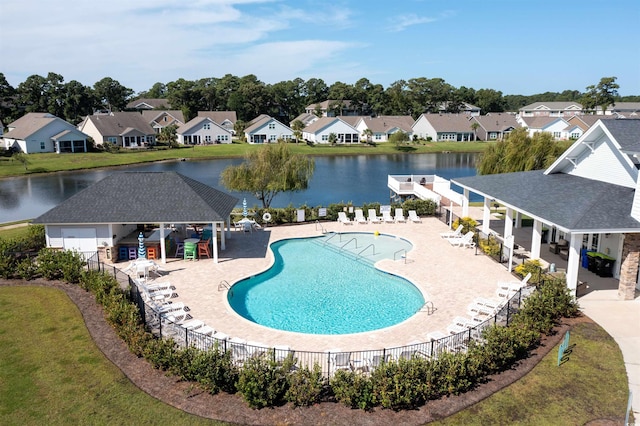 view of swimming pool with a water view, a gazebo, and a patio area