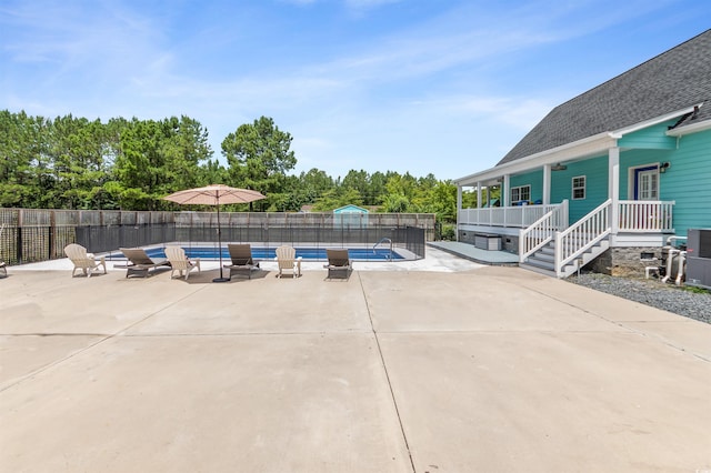 view of swimming pool with a patio area