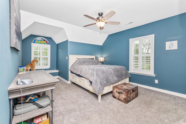 carpeted bedroom featuring vaulted ceiling and ceiling fan