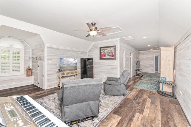 living room featuring ceiling fan, lofted ceiling, and dark wood-type flooring