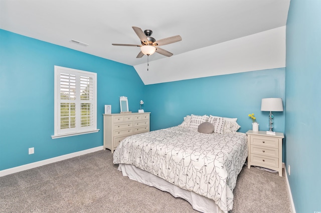 carpeted bedroom featuring vaulted ceiling and ceiling fan