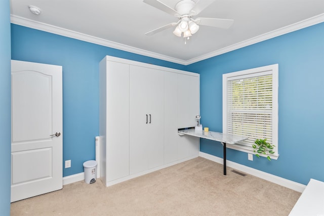 office area with light carpet, ceiling fan, and ornamental molding